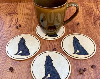 Set of handmade, wood burned wolf silhouette coasters