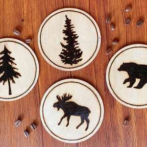 Set of handmade, wood burned North American Wildlife silhouette coasters