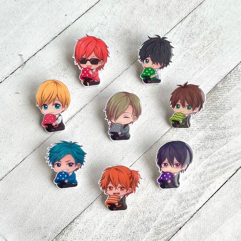 May include: Set of ten colorful cartoon character pins featuring different characters with mushroom accessories. The pins are made of metal and have a shiny finish.