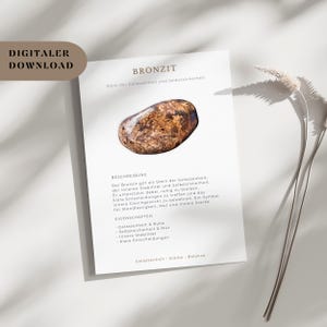 May include: A digital download featuring a Bronzite stone, known for promoting inner stability and self-assurance. The image includes text in German describing the stone's properties and benefits, with a neutral background.