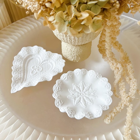 105 favorites validates real demand for this jesmonite lace-textured trinket dish — the vintage lace imprint gives it a genuinely distinctive surface that plain ceramics can't replicate.