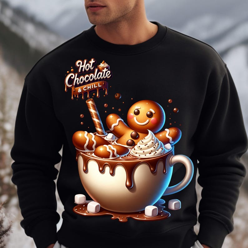 May include: A black sweatshirt with a graphic of a gingerbread man in a mug of hot chocolate. The text "Hot Chocolate & Chill" is above the mug.