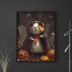 May include: A guinea pig dressed as a vampire with a black cape and a red bow tie holds a knife in a graveyard setting with pumpkins and spiders.
