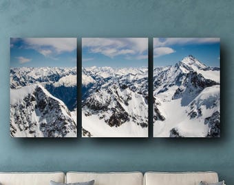 May include: A three-panel canvas print of a snowy mountain range. The print is 36 inches by 72 inches and is displayed on a white couch in a living room. The text "Livingroom size chart" and "36x72 in / 91x182 cm" is visible in the image.