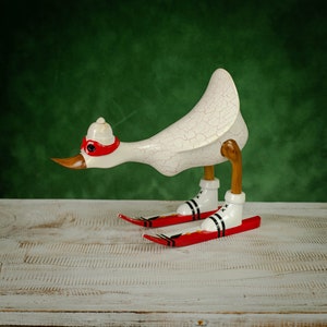 Hand Carved, Hand Painted Wooden Sculpture of a Duck in White on Skis