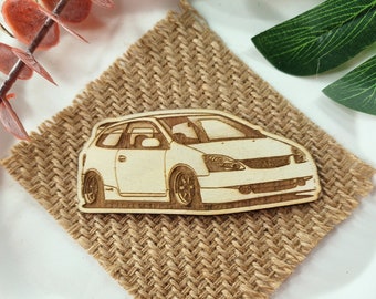 May include: A white wooden cutout of a car on a brown burlap background. The car has a detailed design with a black grill and headlights.