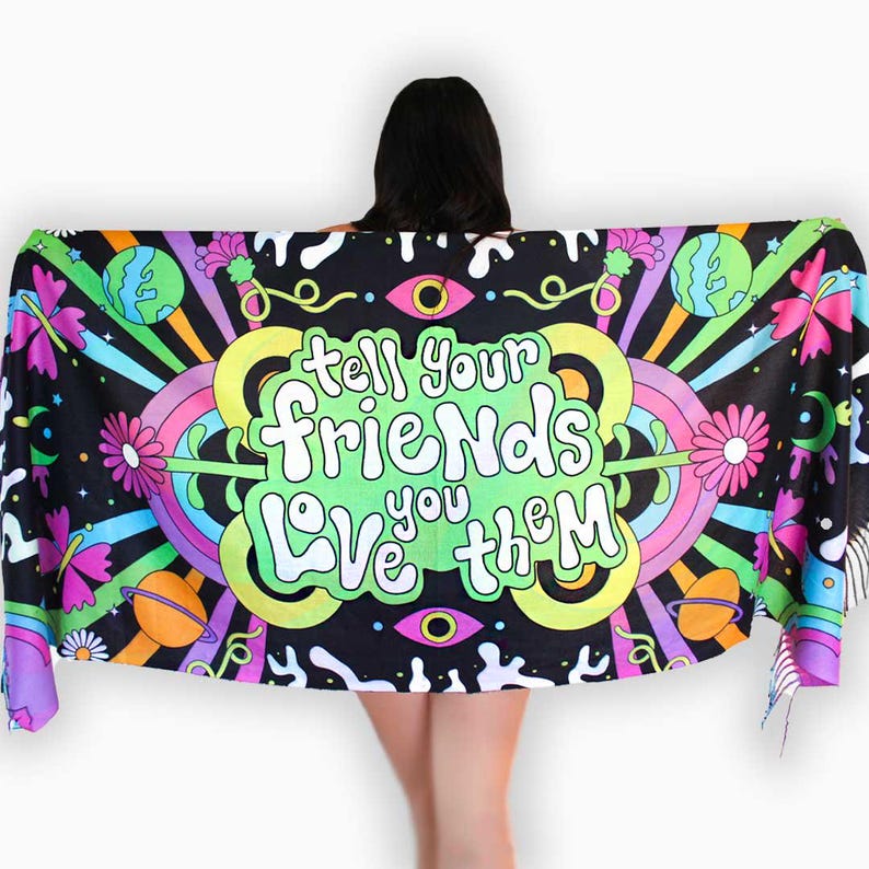 May include: A colorful tapestry with a psychedelic design featuring a rainbow, planets, flowers, and the text "Tell your friends love you them".