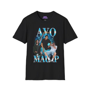 May include: Black t-shirt with a graphic print of three men in front of a blue and white background. The text "AYO get 'em MAUP" is printed in blue and white.