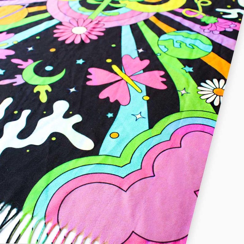 May include: A colorful tapestry with a psychedelic design featuring a butterfly, flowers, stars, and a cloud. The tapestry has a fringe border.