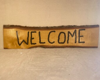 Welcome sign with live edge
