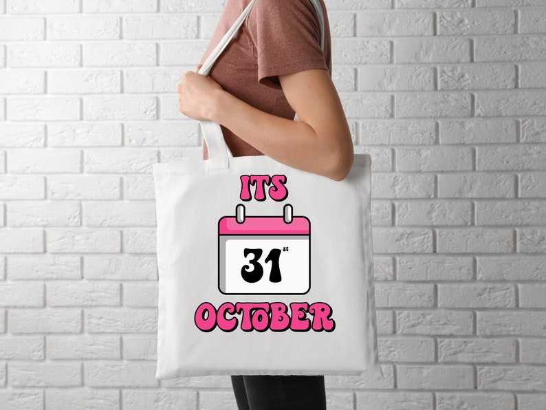 May include: White tote bag with a pink calendar design and the text "IT'S 31" OCTOBER".