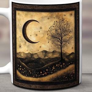 May include: White ceramic mug with a black and gold design. The design features a crescent moon, a tree, and a mountain range in the background. The design is surrounded by a black frame with gold accents.