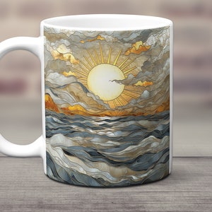 May include: White ceramic mug with a colorful illustration of a sun setting over a wavy ocean. The sun is yellow with orange rays and the ocean is blue and gray.