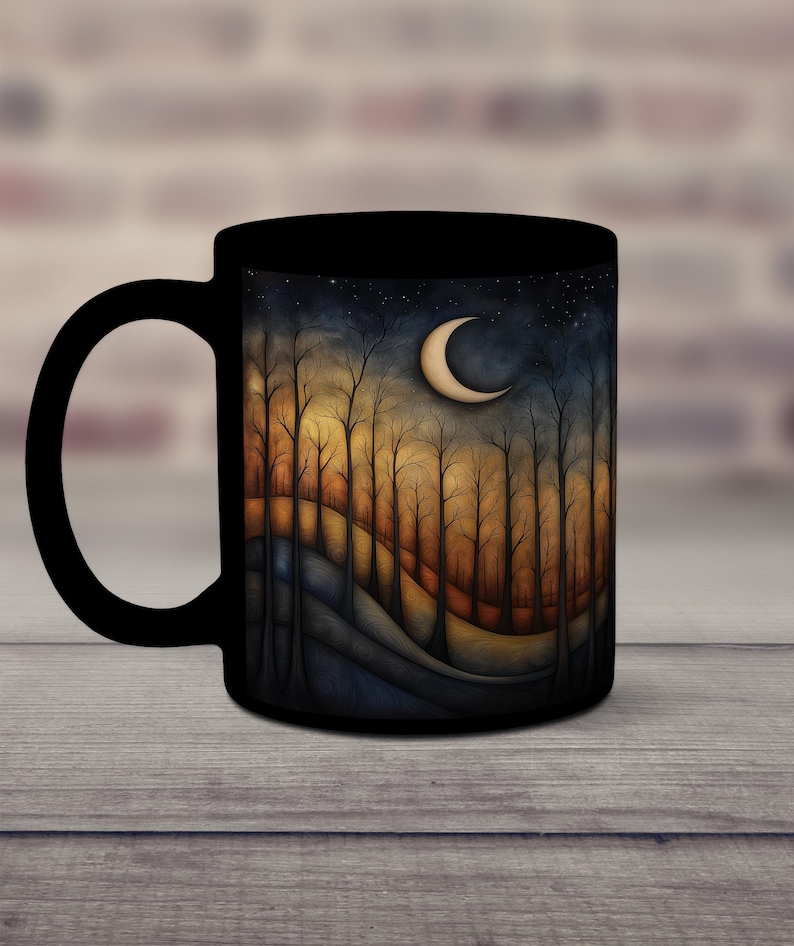May include: Black ceramic mug with a colorful illustration of a crescent moon and trees in a forest setting. The trees are silhouetted against a dark blue sky with stars.