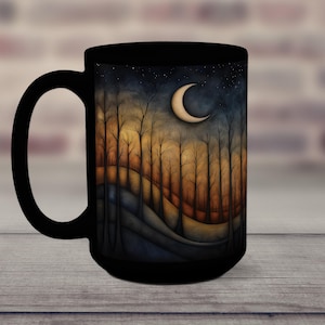May include: Black ceramic mug with a crescent moon and starry night scene. The scene features a forest of trees with a rolling hill in the foreground.