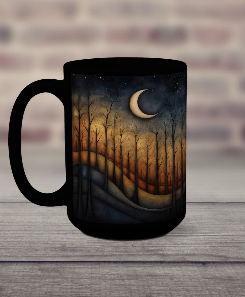 May include: Black ceramic mug with a crescent moon and starry night scene. The scene features a forest of trees with a rolling hill in the foreground.