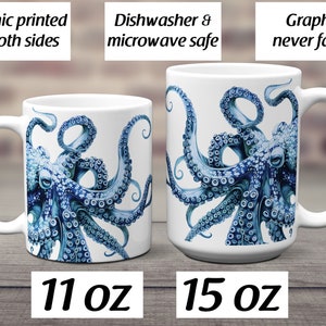 May include: Two white ceramic mugs featuring a blue octopus illustration. The mugs are labeled 11 oz and 15 oz. Text on the image states: Graphic printed on both sides, Dishwasher & microwave safe, Graphic never fades. The mugs have handles.