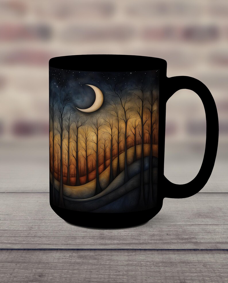 May include: Black ceramic mug with a crescent moon and forest scene design. The scene features a dark blue sky with stars, a crescent moon, and a forest of trees with orange and brown leaves. The background is a dark blue and purple gradient.