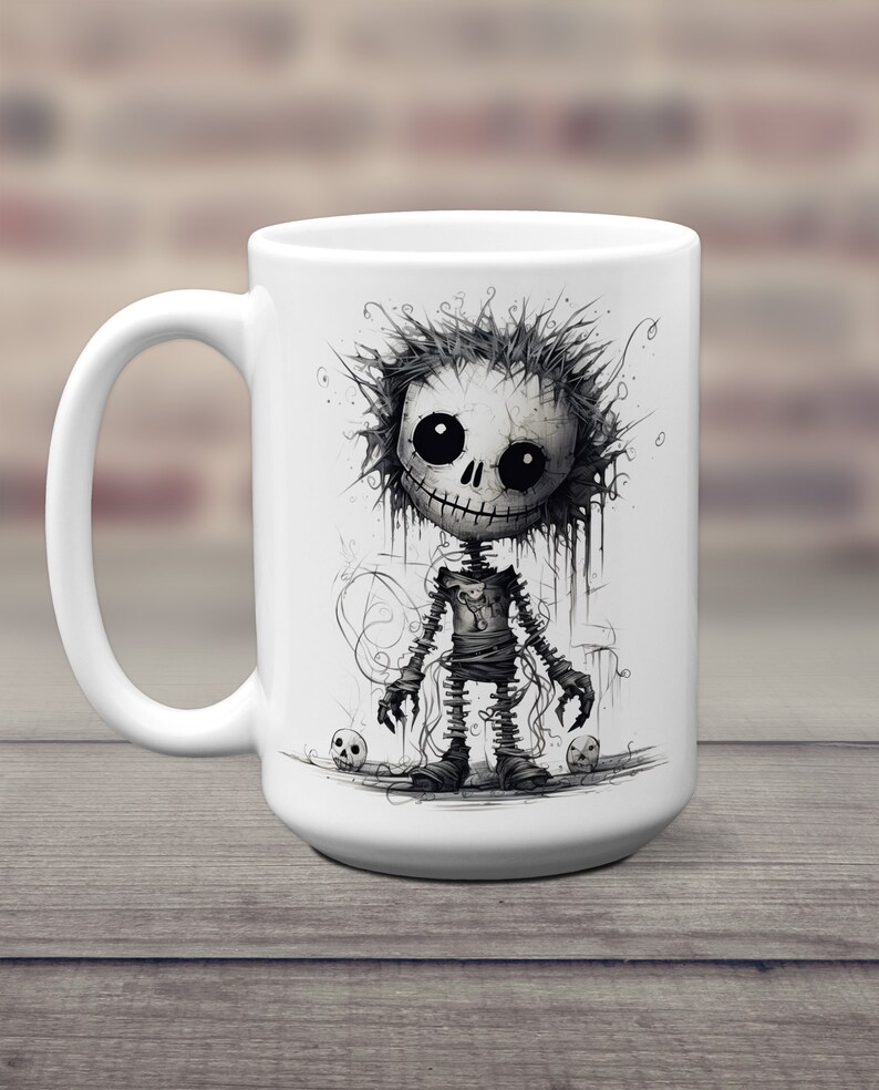 May include: White ceramic coffee mug with a black and white illustration of a cartoon skeleton with a stitched-up body and a toothy grin. The skeleton is standing on a white background with two small skulls on either side.