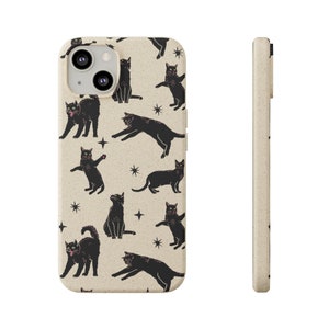 May include: A beige phone case with a black cat pattern and stars. The case is made of a textured material and has a cutout for the camera lens.