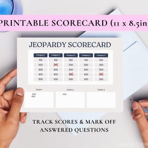 May include: Printable Jeopardy Scorecard, 27.9 x 21.6 cm. The scorecard features a grid for tracking scores across five categories, with point values from 100 to 500. Includes space to track scores for three teams. Text reads: "Track Scores & Mark Off Answered Questions."