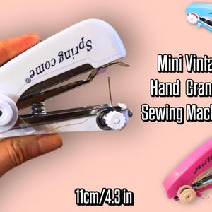 May include: A white mini hand crank sewing machine with the text "Spring come" printed on the top. The image also shows a blue and pink version of the sewing machine. The machine is 11 cm long.