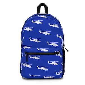 May include: A blue backpack with a white helicopter pattern. The backpack has a zippered front pocket and adjustable straps.