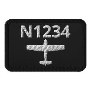 May include: Black embroidered patch with a white airplane silhouette and the text "N1234".
