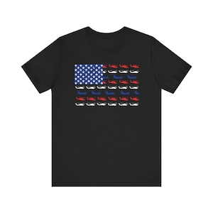 May include: Black t-shirt with a red, white, and blue American flag design made of helicopters.