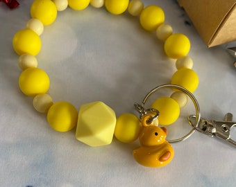 Hands-free key ring bracelet with small canary bell