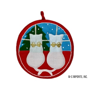 May include: Red, white, and blue Christmas pot holder with two white cats sitting under a green Christmas tree. The cats have gold bows around their necks. The text "W-C IMPORTS, INC." is at the bottom of the image.