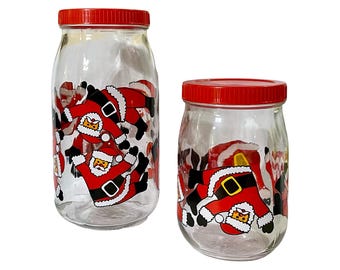 Vintage Tumbling Santa Clause Glass Canister Jar Set by VMC Reims, (Set of 2), Made In France, Lidded Glass Jar, Christmas Decor - (1980’s)