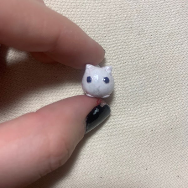 Mini cat sculptures