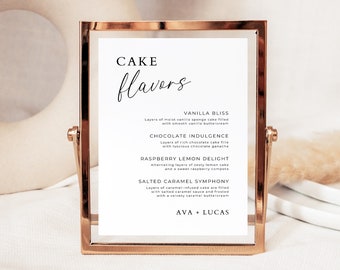 Può includere: Un cartello con cornice dorata, sfondo bianco e testo nero che elenca i gusti di torta: Vanilla Bliss, Chocolate Indulgence, Raspberry Lemon Delight e Salted Caramel Symphony. Il cartello include anche i nomi Ava e Lucas.