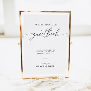 以下が含まれることがあります： 金色の額縁に入った白い看板に「PLEASE SIGN OUR guestbook LEAVE A MESSAGE FOR US NOW, SO WE CAN TREASURE IT LATER thank you GRACE & JOSH」という文字が書かれている