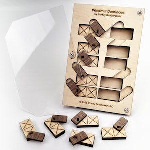May include: A wooden puzzle game called Windmill Dominoes by Serhiy Grabarchuk. The game includes a wooden box with a cutout design and eight wooden domino pieces. The box has the text "Windmill Dominoes by Serhiy Grabarchuk" and "© 2025 Crafty Sunflower LLC".