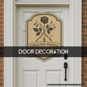 May include: A decorative door sign with a vintage design. The sign features a black rose and crossed stems with leaves, and the words "FOXGLOVE PARISH" and "DOOR DECORATION" in a serif font. The sign is mounted on a white door.