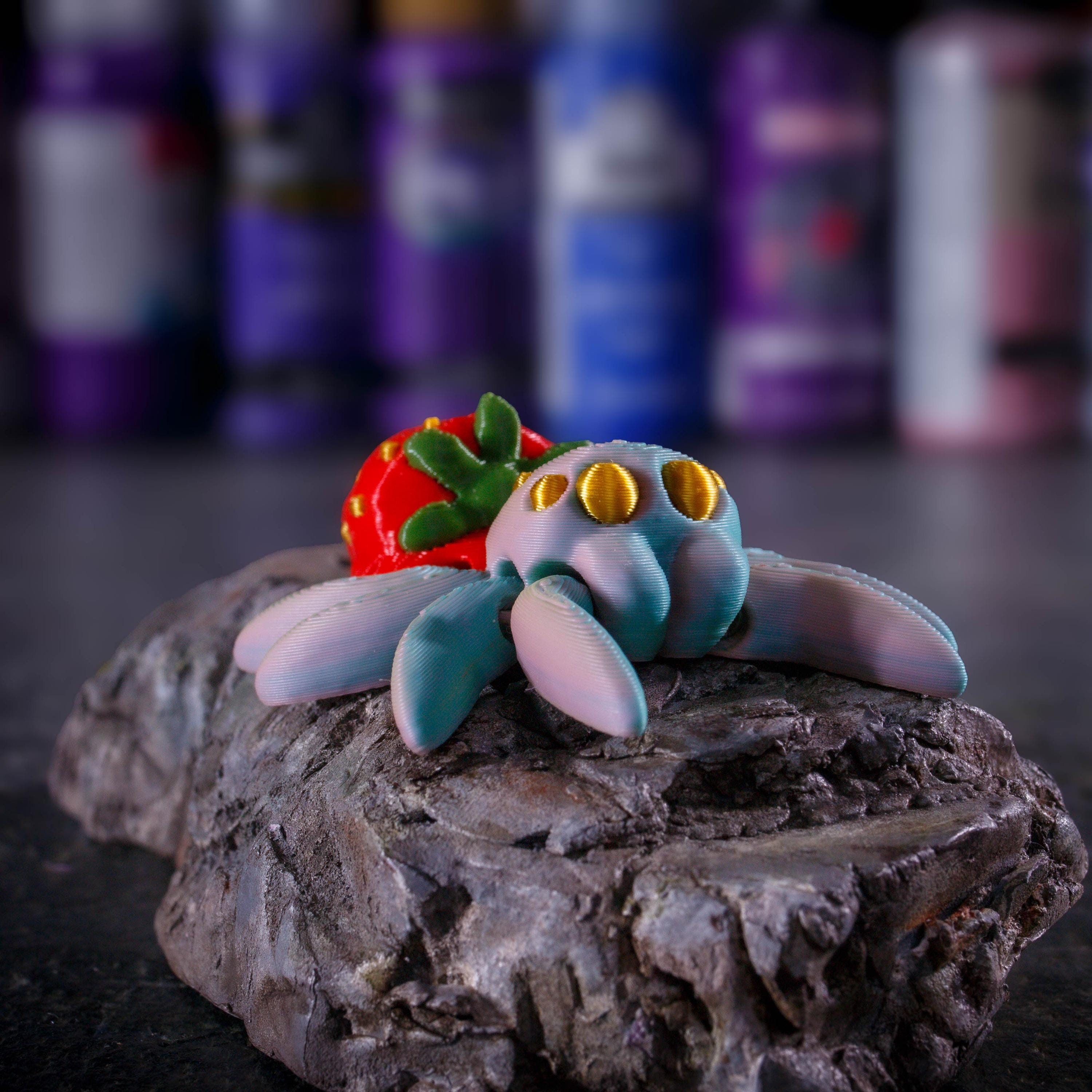 3D printed articulated strawberry spider fidget toy for stress relief and relaxation