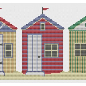 May include: Three colorful beach huts with white doors and windows. The hut on the left has a blue roof and an anchor on the front. The middle hut has a red roof and the hut on the right has a green roof.