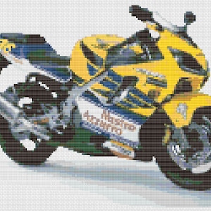 May include: A yellow and blue motorcycle with the text "Castrol" and "Mistral" on the side.