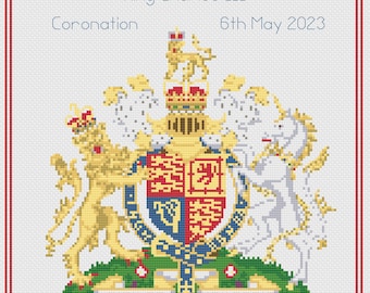 May include: A cross-stitch design featuring the Royal Coat of Arms, with the text "King Charles III Coronation 6th May 2023". The design includes a red border and detailed heraldic elements in gold, red, blue, and white.