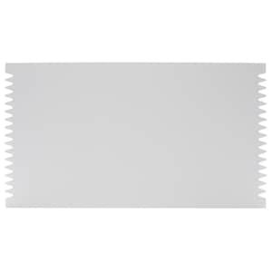May include: A rectangular white plastic icing comb with serrated edges on both short sides. The tool features a smooth, flat centre surface and uniform, triangular teeth along the left and right vertical edges for creating textured patterns.