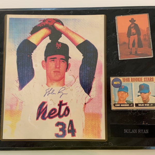 Nolan Ryan signed 8 by 10 rare photo, with COA.  Plaque, with 1968 replica rookie card and Texas ranger replica card