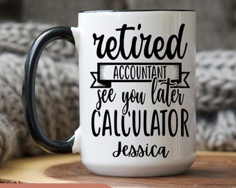 May include: White ceramic coffee mug with a black rim and handle. The mug has black text that reads "retired accountant see you later calculator Jessica".