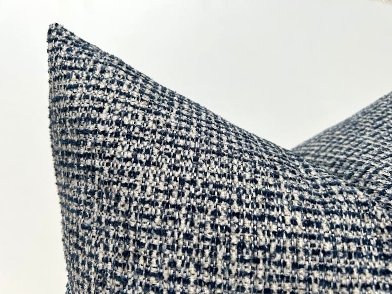 This cushion cover will impress with its textured soft boucle fabric and navy blue and white colours. Our throw pillows are double-sided and have a hidden zipper, and are available in all sizes, including large and lumbar.
