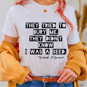 They Tried To Bury Me Unisex Softstyle T-Shirt