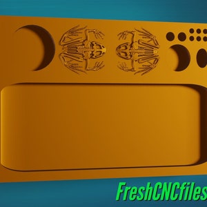 Pode incluir: Uma bandeja dourada com uma borda elevada e um recorte em forma de lua crescente. A bandeja tem dois esqueletos de sapo na borda superior e uma série de pequenos círculos no lado direito. A bandeja é feita de madeira e tem um acabamento liso e polido.