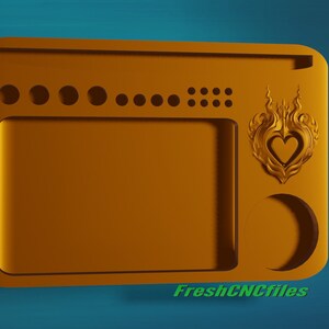 Puede incluir: Una bandeja de madera de color dorado con un diseño en forma de corazón y una forma de media luna. La bandeja tiene un gran espacio rectangular en el centro y una fila de pequeños círculos en la parte superior.