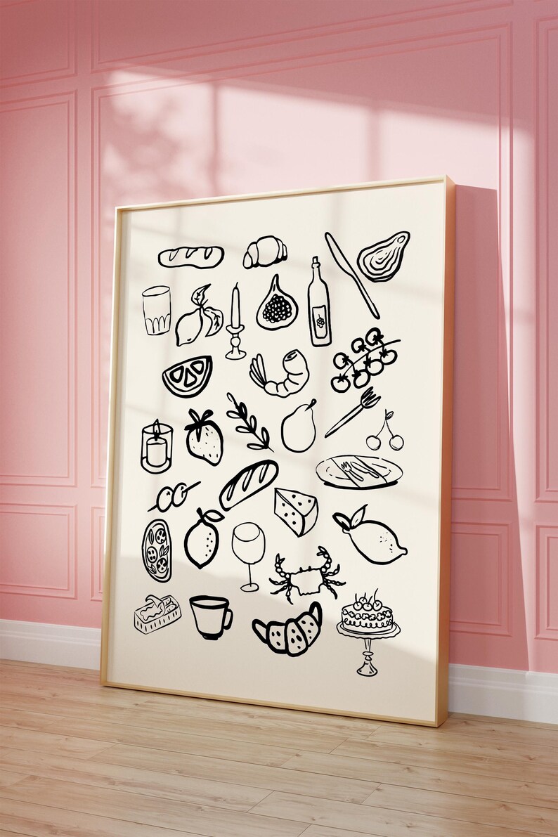 May include: A black and white illustration of various food and drink items, including lemons, grapes, bread, a crab, a shrimp, a pear, a fig, a candle, a wine bottle, a glass of wine, a cup, a cake, and a plate with cutlery. The illustration is on a white background and is framed in a gold frame.