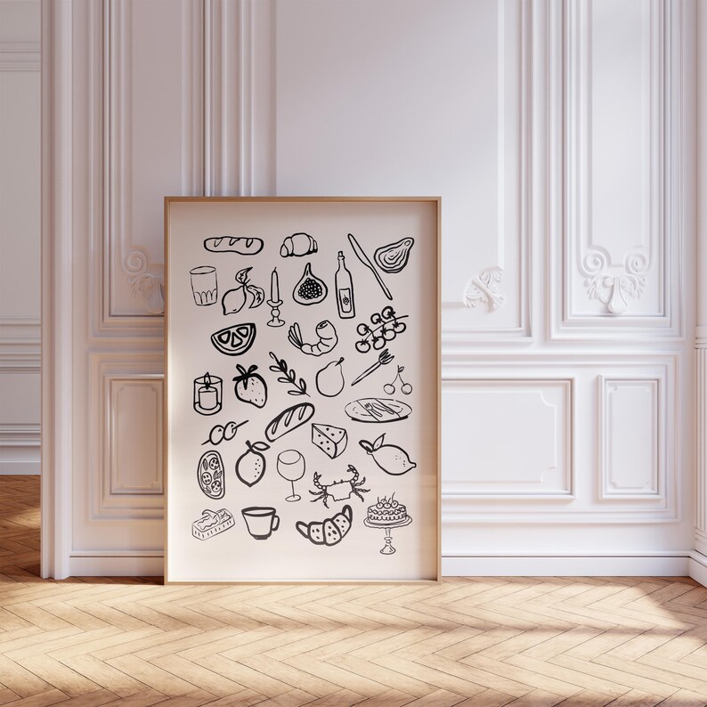 May include: Black and white illustration of various food and drink items, including lemons, bread, wine, a crab, a cake, and a fig. The illustration is on a white background and is framed in a wooden frame.